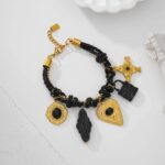 Bracelet noir et or à breloques – Élégance baroque en acier inoxydable